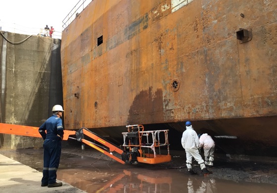 In-progress UHP water jetting is shown here. Mario Dovo, project manager at Marine Metal Coatings, inspects the job.